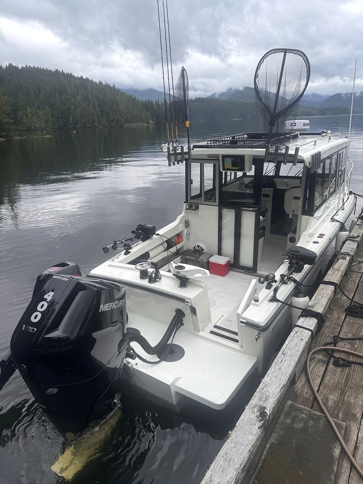 Boat at the dock at Broken Island Group Properties