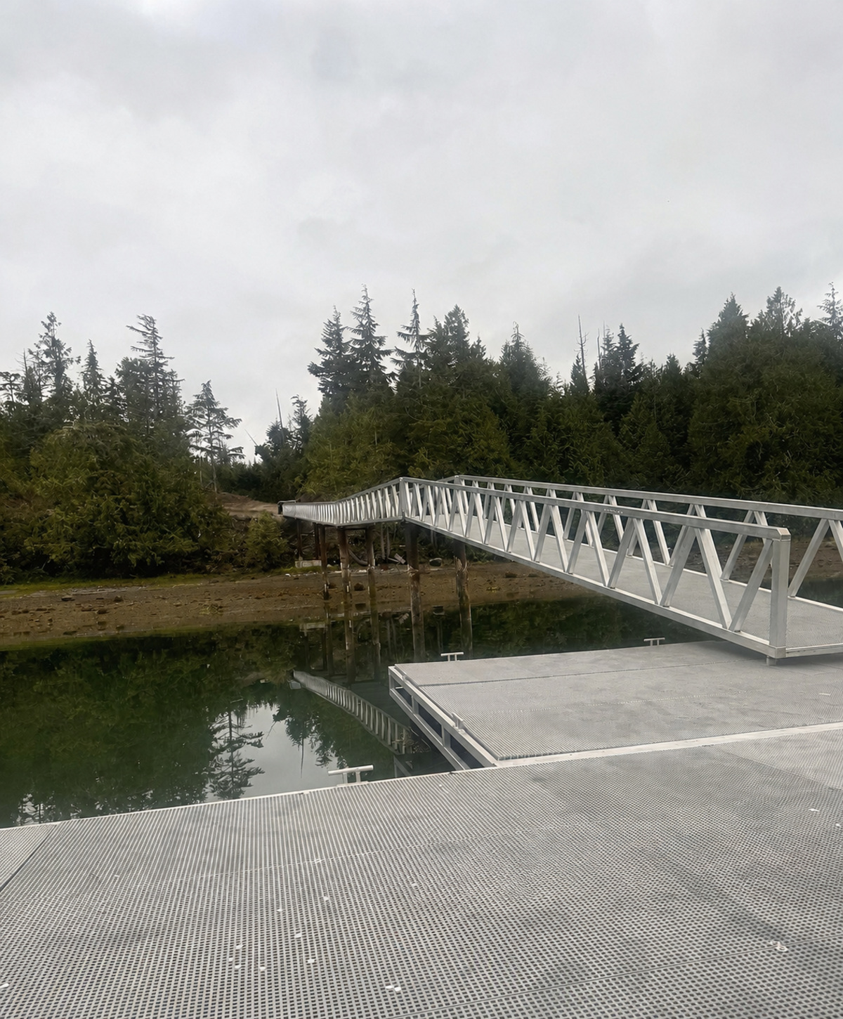 Large private dock and aluminum gangway at the Bamfield waterfront property